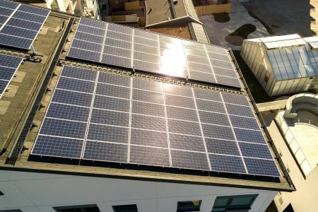aerial-view-of-solar-photovoltaic-panels-on-a-roof-2024-12-07-00-44-07-utc-scaled.jpg